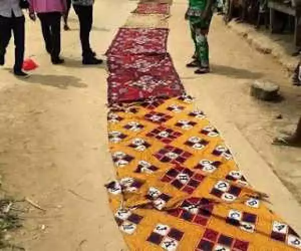 Photos: Women In Bayelsa State Lay Their Wrappers On The Road For Gov. Dickson To Walk On